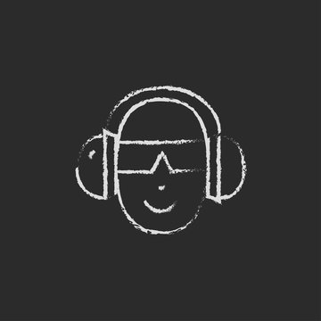 Man in a headphones icon drawn chalk.
