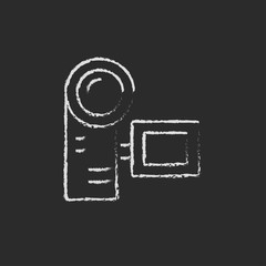 Digital video camera icon drawn in chalk.