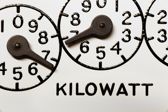 Mechanical electric kilowatt hour meter register dials macro image