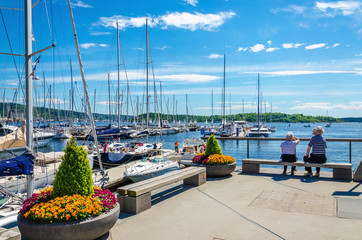 Yachts and pier with flowers, Oslo Fjord, Norway - obrazy, fototapety, plakaty