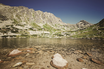 Fototapeta na wymiar Summer alpine mountain lake
