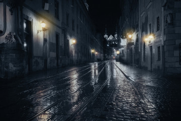 Rainy night in old European city - 92123087