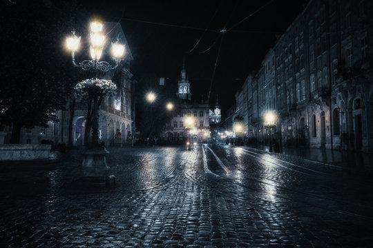 Old European City At Rainy Night
