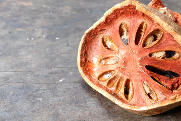 Obraz na płótnie Canvas Dry Bael Fruit (Aegle marmelos) on vintage wooden table