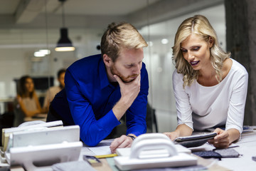 Obraz premium Man and women designing in studio