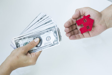 Hand Giving Money For Housing