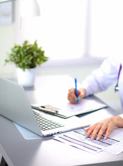 Portrait of happy medical doctor woman in office