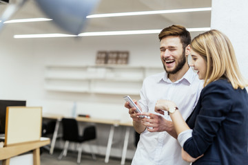 Business people having fun during break in an office