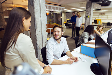 People working at busy modern office