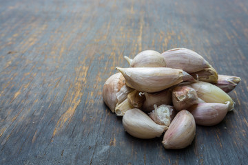Garlic isolated on wood background
