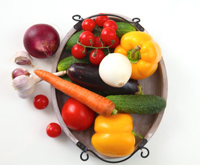 Fresh autumn vegetables on a white background