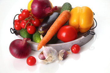 Fresh autumn vegetables on a white background