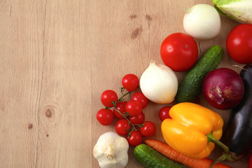 Pile of organic vegetables on a wooden table