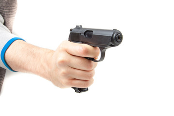 Man's hand holding gun, isolated on white.