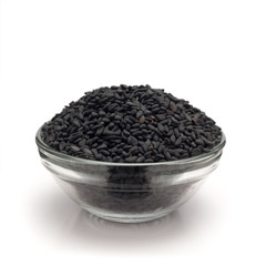 Front view of Organic Black Sesame (Sesamum indicum) in glass bowl isolated on white background.