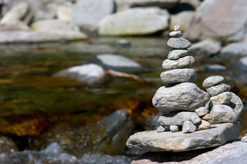 Stone in balance near a river