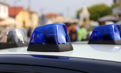 Blue police car siren while patrolling in the city