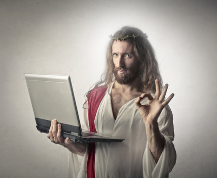 Jesus holding a pc