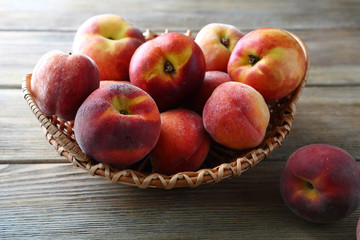 Fototapeta na wymiar ripe peaches in basket