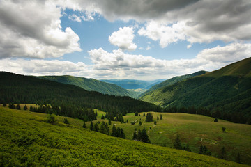 Fototapeta na wymiar Landscape green mountains on blue sky background and white cloud
