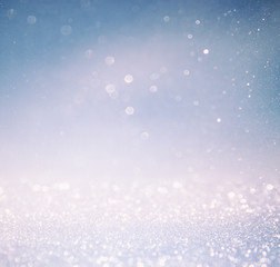 bokeh lights background with multi layers and colors of white silver and blue
