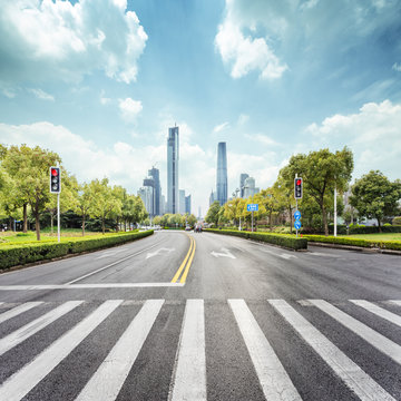 Empty Road With Zebra Crossing And Skyscrapers