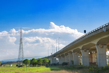 Concrete highway bridge and power lines