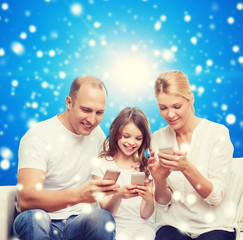 happy family with smartphones