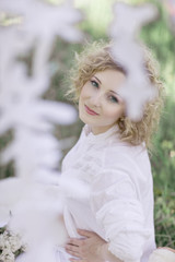 Naklejka premium beautiful face female enjoying cherry blossom