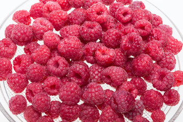 A beautiful selection of freshly picked ripe red raspberries.