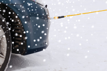 closeup of towed car with towing rope