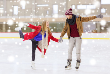 happy couple holding hands on skating rink