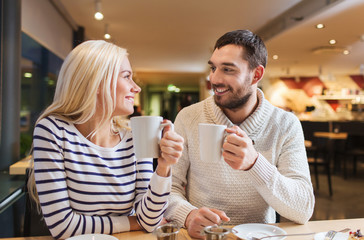 happy couple meeting and drinking tea or coffee