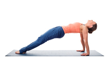 Sporty fit yogini woman practices yoga asana purvottanasana