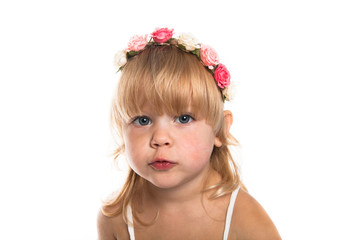 Girl with a wreath  on her head on a white background