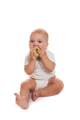 baby with an apple  on a white background
