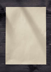Blank paper on old wooden wall background for put your text.