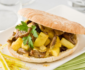 Pita sandwich with meat and apple