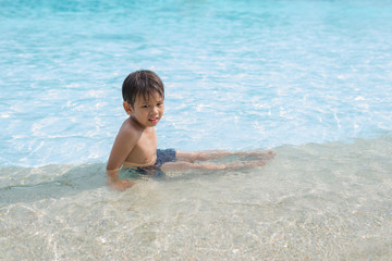 Asian  kid in swimming pool