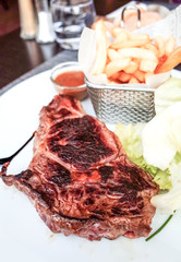 juicy steak beef meat with tomato and french fries