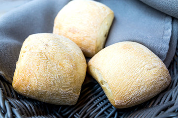 bread in basket - little roll breads in basket on table