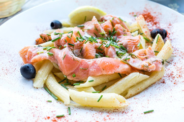 tasty pasta with salmon on a the table