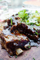 Grilled steak - Grilled meat ribs on the plate with hot sauce