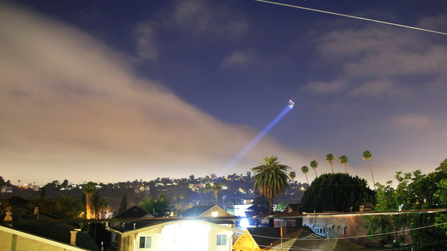  Time lapse footage with zoom out motion of LAPD Helicopter searching for suspect at night