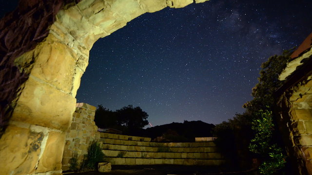  3 axis motion controlled astrophotography time lapse footage with dolly in, tilt up & pan right motion of starry sky over abandoned brick ruin structure at Knapp's Castle in Santa Barbala, California