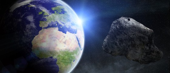 Fototapeta premium Asteroids threat over planet earth