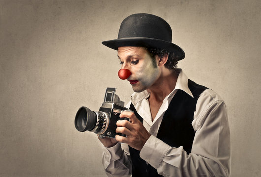 Clown taking a picture