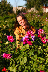 Naklejka premium Young woman in garden.