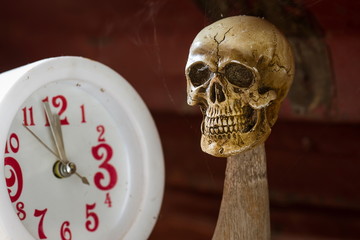 Skull waiting time on clock vintage tone