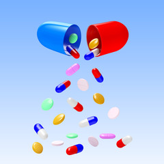 Colorful pills falling from the open medical capsule on blue background  